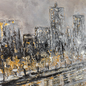 Wandbild das Stadtgefühl und Uferruhe vereint – goldene Skyline über dunklem Wasser
